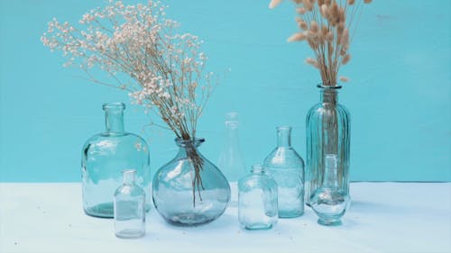 Glass Items with Dried Flowers Inside