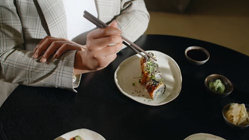 A Person Holding Chopsticks
