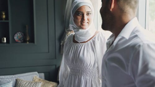 Woman Wearing Hijab Talking to a Man