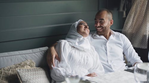 Couple Sitting on Sofa