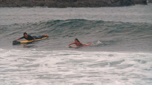 A Woman Surfing a Wave