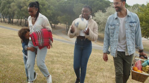 A Family Walking in a Park