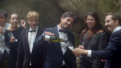 Man Wearing Suit Pouring Champagne