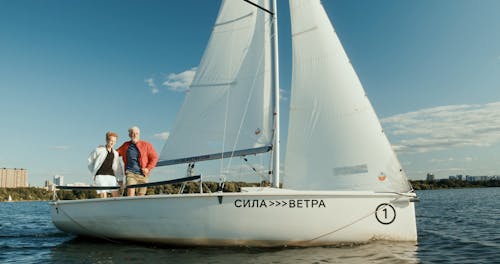 Elderly Man and a Boy on a Sailing Boat