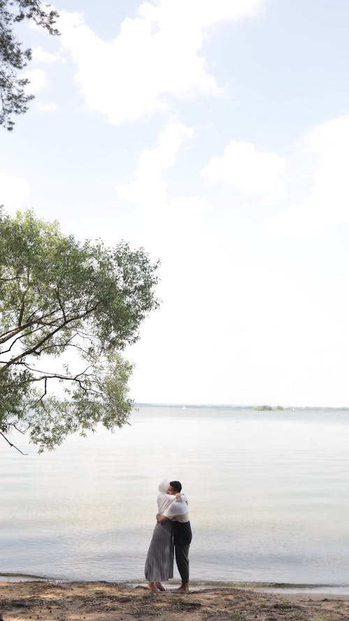 Couple Hugging Each Other at the Beach