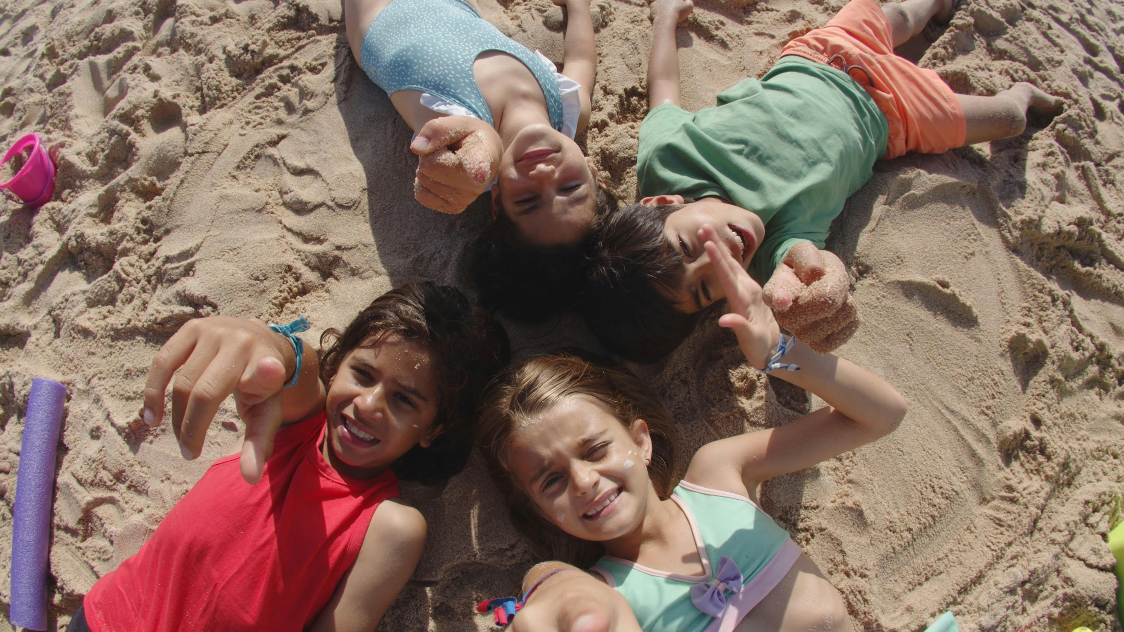 Kids Lying Down on the Beach Sand · Free Stock Video