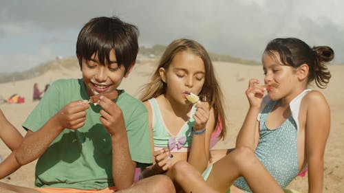 Kids Eating Ice Cream in the Beach