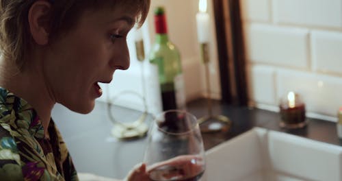 Person Talking to a Woman in the Bathroom