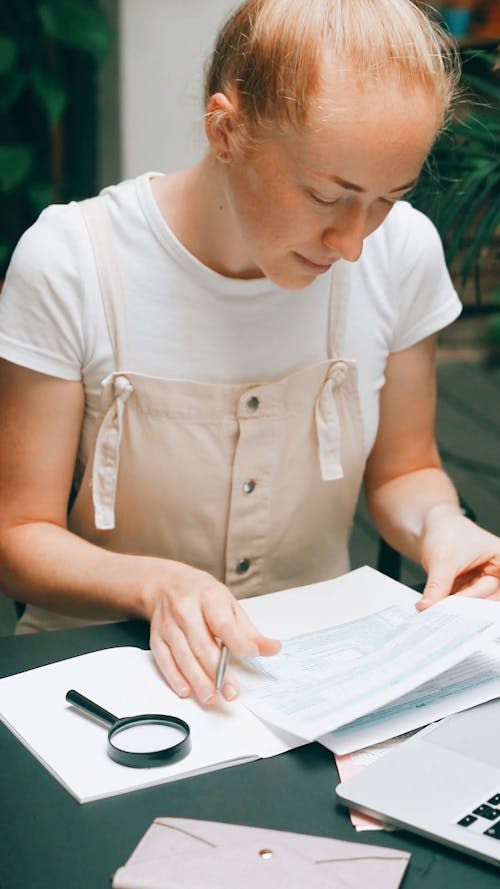 A Woman Looking at Her IRS Tax 