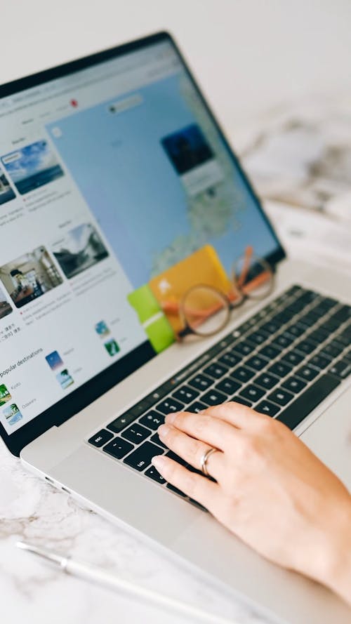 Person Browsing on Laptop · Free Stock Video