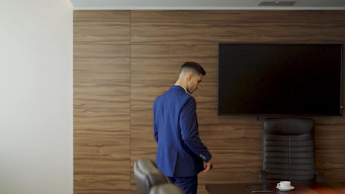 A Businessman Inside a Conference Room