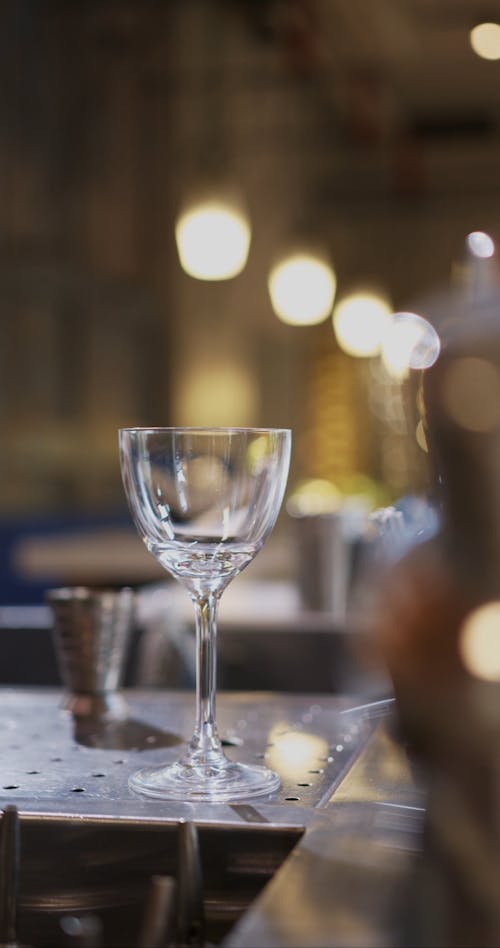 Person Pouring Drinks in the Glass