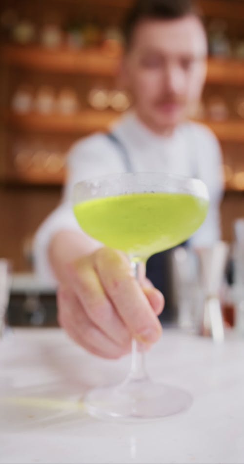 Person Serving a Cocktail