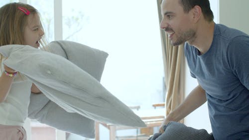 Father and Daughter Pillow Fight