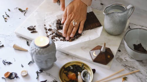 Close-up Footage of a Person Cutting Chocolate Bar