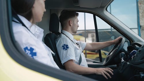 A Man and Woman Sitting Inside the Car