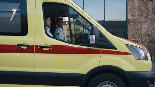 A Man Driving an Ambulance Car