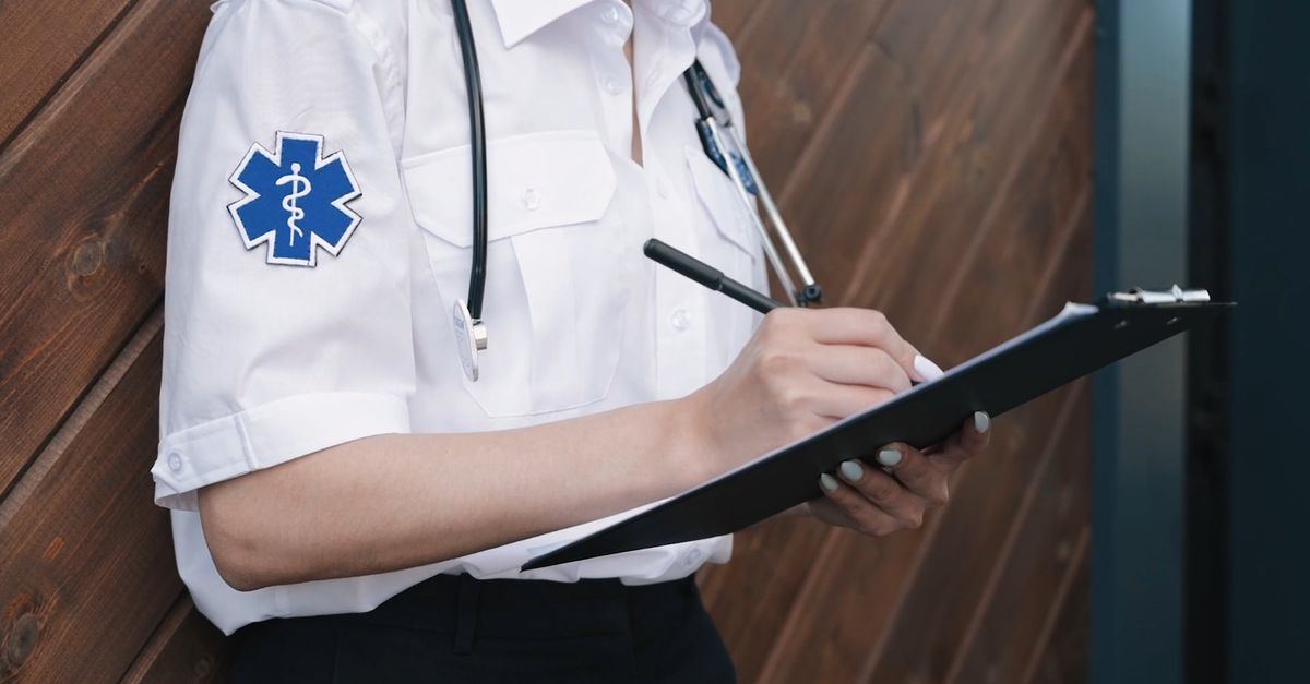 A Paramedic Woman Writing on a White Paper Free Stock Video Footage ...