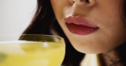 Extreme Close up of a Woman and a Cocktail