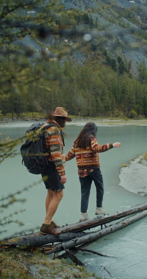 A Couple Crossing the River