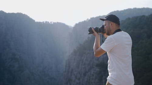 A Man using a Camera