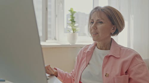 An Elderly Woman Using a Computer