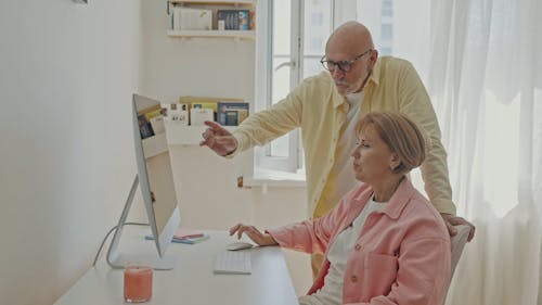 An Elderly Couple Using a Computer