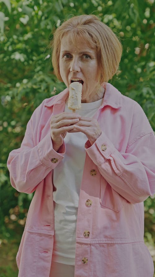 An Elderly Woman Eating Popsicle Ice Cream