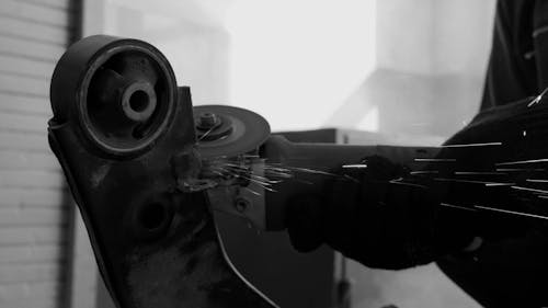 A Worker Using an Angle Grinder