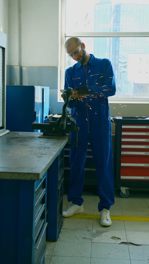 A Man Using a Grinder