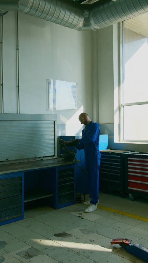 A Man Using a Grinder