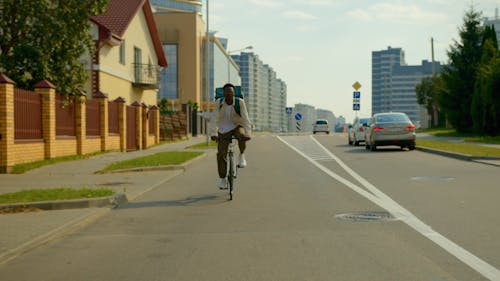 A Delivery Man Riding a Bicycle 