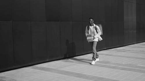 Man Carrying a Thermal Bag While Walking