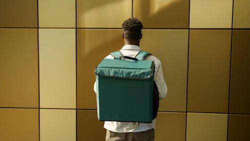Man Carrying a Thermal Bag