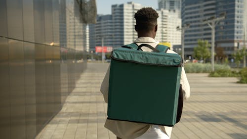 Man Carrying Thermal Bag While Walking