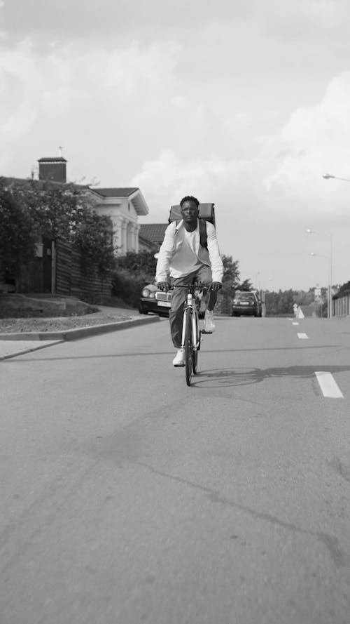 Man Riding Bicycle on the Street