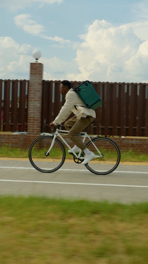 A Delivery Man Riding his Bicycle