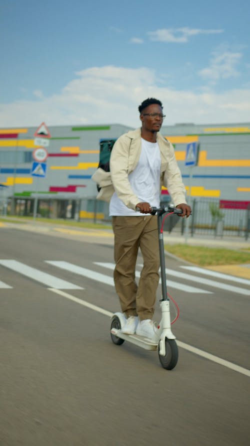 Person Riding a Scooter