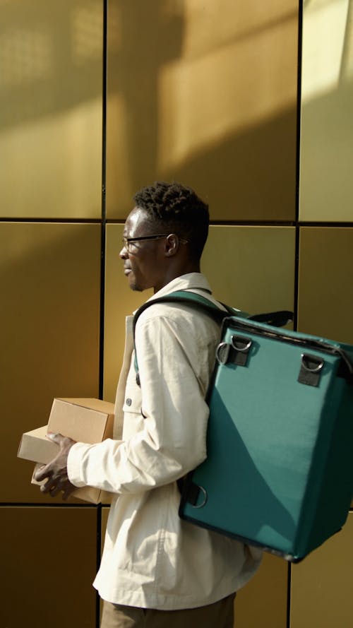 Man Carrying Thermal Bag Holding Parcels