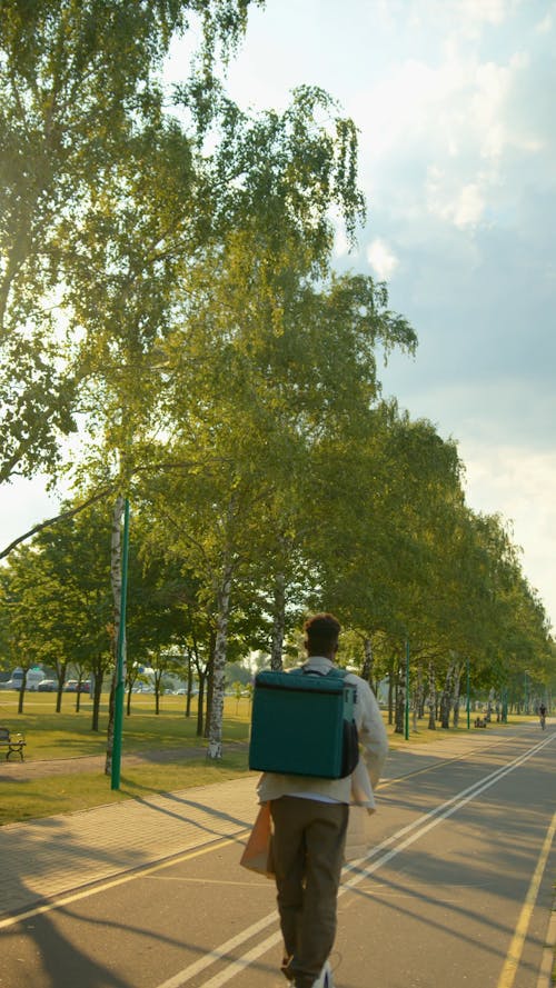 Person Riding a Scooter