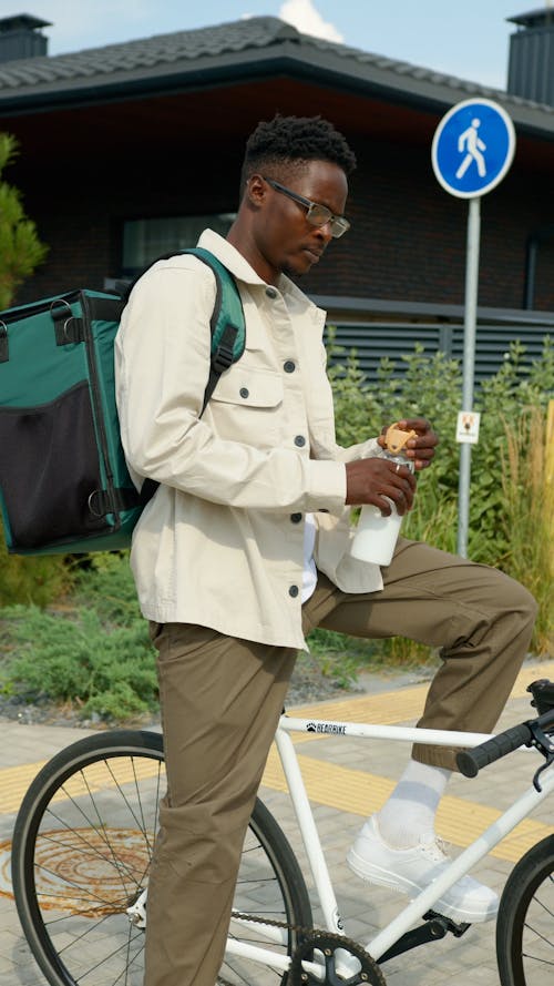 Man Carrying Thermal Bag Drinking Water