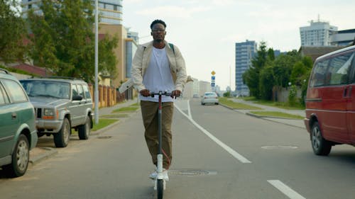 A Delivery Man Riding a Scooter