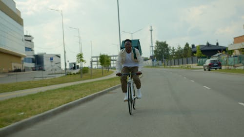 A Delivery Man Riding his Bike