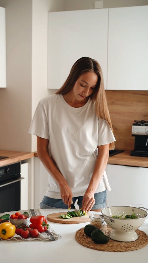 Woman Slicing Cucumber