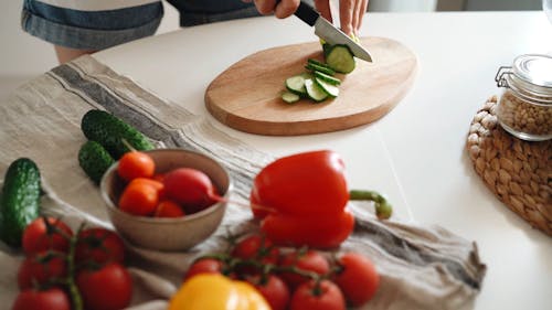 Close Up Video of a Person Slicing Cucumber