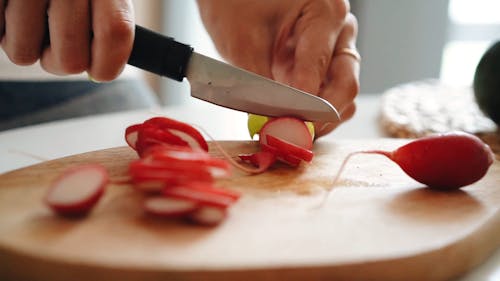 Close Up Video of a Person Slicing Raddish