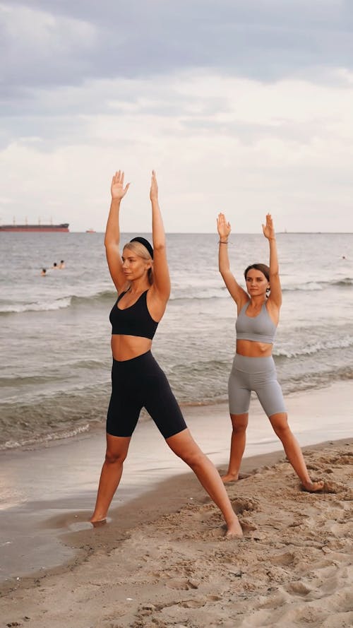 Women Doing Yoga at a Beach 