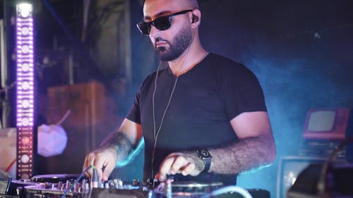 A Disc Jockey Performing on Stage