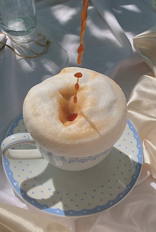 Overflowing Foam in a Coffee Cup