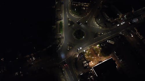 A Drone Footage of Night Lights and Moving Cars